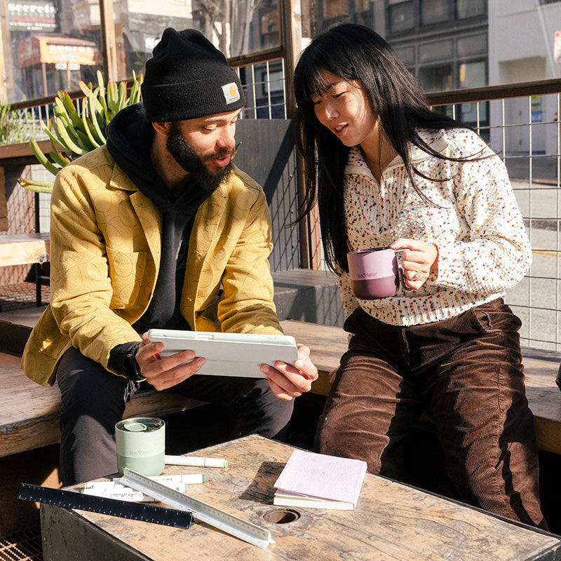 12oz-rise-mug-u5 12oz_rise_coffee_mug_dusty_orchid_couple_city_patio_square.jpg