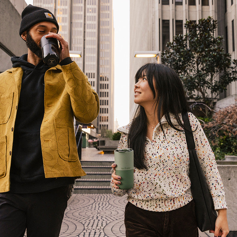 bring-your-own-party-kit-pints-and-tumblers-w3 16oz_rise_tumbler_black_iceberg_couple_drink_city_street_square.jpg