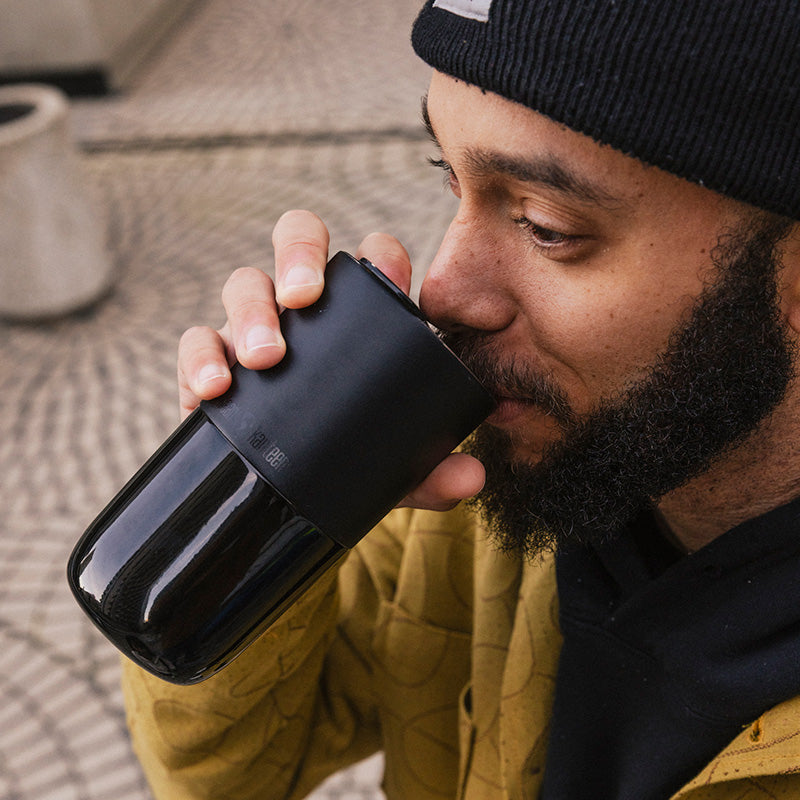 16oz-rise-tumbler-b7 16oz_rise_tumbler_black_man_drink_square.jpg