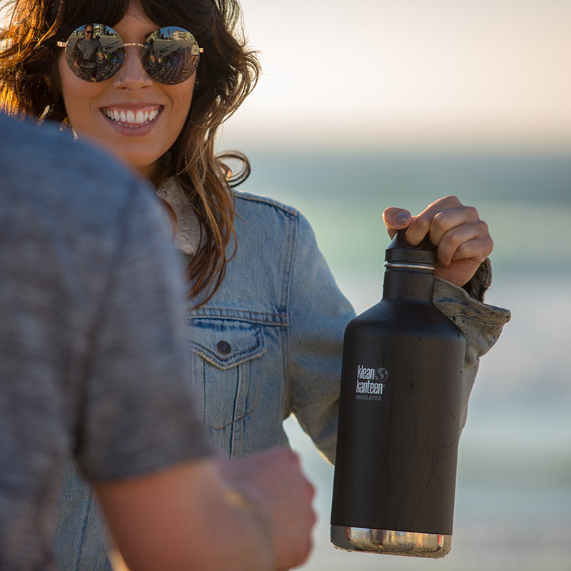 64oz-classic-with-loop-cap-n3 64oz_insulated_classic_black_beach_girl_hand_square.jpg