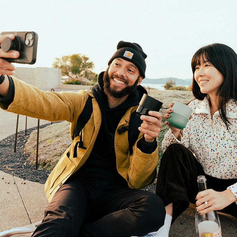bring-your-own-party-kit-tumblers-and-cocktails-a7 8oz_rise_lowball_black_iceberg_couple_selfie_city_square.jpg